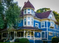 Porch deck with natural wood rails and steps in Old West End Toledo