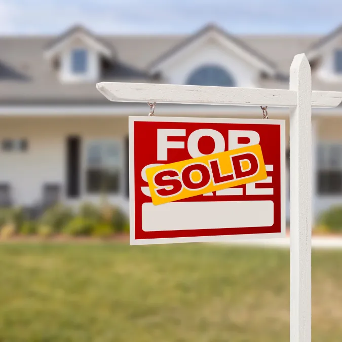 Sold home sign in front of recently purchased property after fast cash sale through Double Advantage Business Services