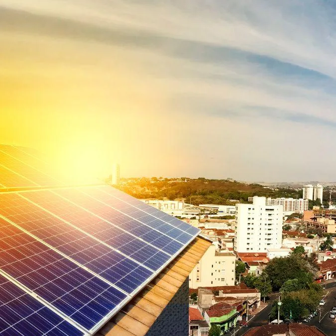 Rooftop solar panels soaking up sunlight above a residential neighborhood as part of a citywide solar energy solution