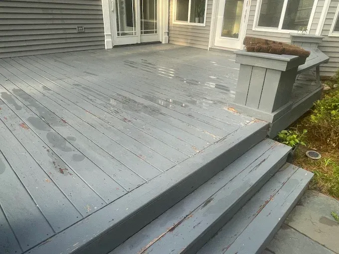 Wood deck cleaning and restoration by Thin Red Line Pressure Washing in Clifton Park, NY.