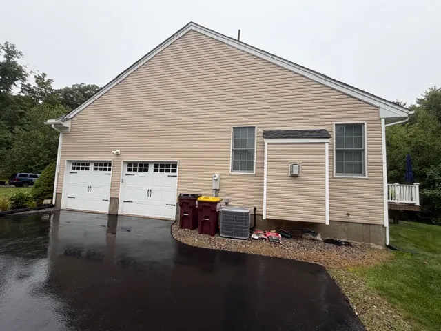 Residential home exterior after professional cleaning by Thin Red Line Pressure Washing in Clifton Park, NY.