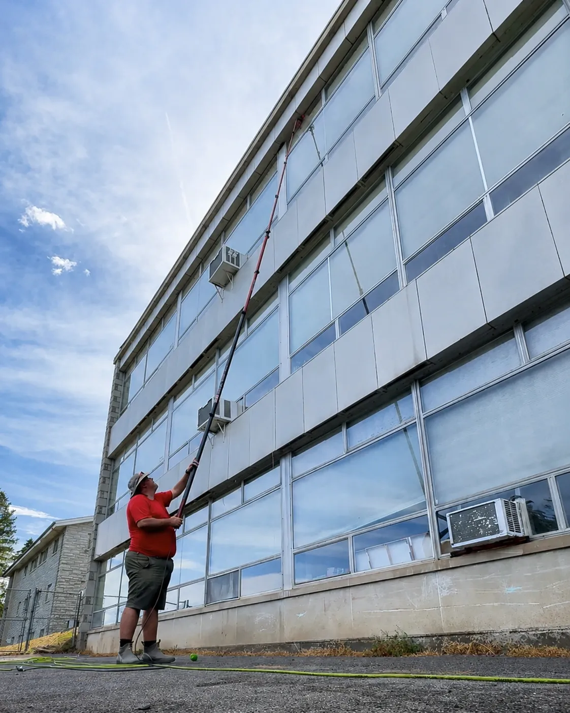 Commercial building exterior cleaning by Thin Red Line Pressure Washing in Clifton Park, NY. 
