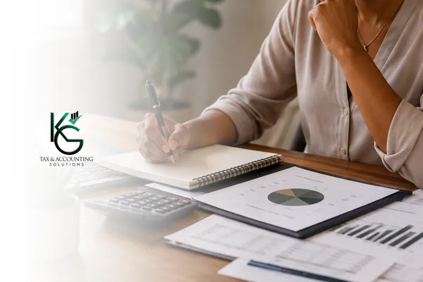 Business owner reviewing financial plans and retirement goals to build long-term wealth.