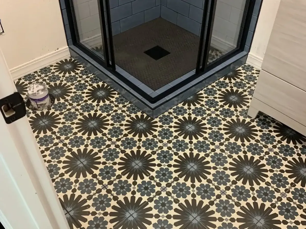 Brightly remodeled bathroom in Spring TX features sleek fixtures, marble countertops, and a freestanding tub enhancing luxury.