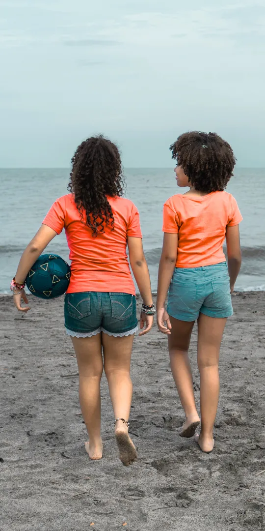 Parent walking with young child seeing signs "Coming soon:Puberty: