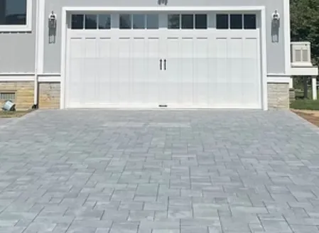 Custom architectural paver patio design with natural stone hardscaping
