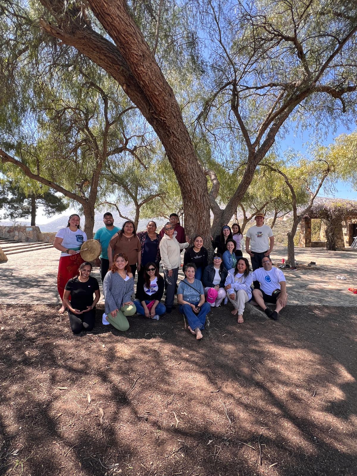 a jar filled with yellow flowers sitting on top of a table