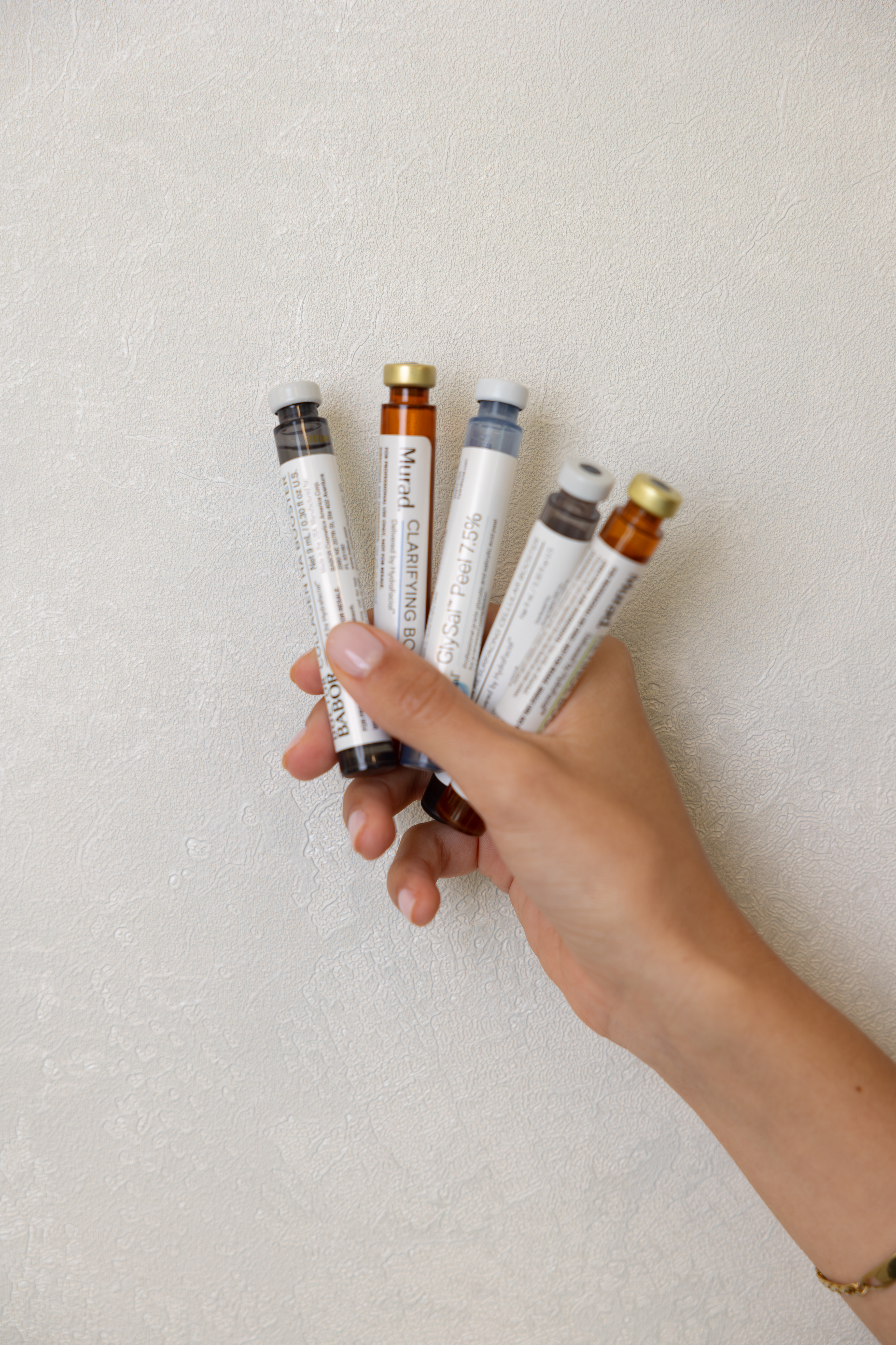 Aesthetic skincare products in a soft-focus clinical setting