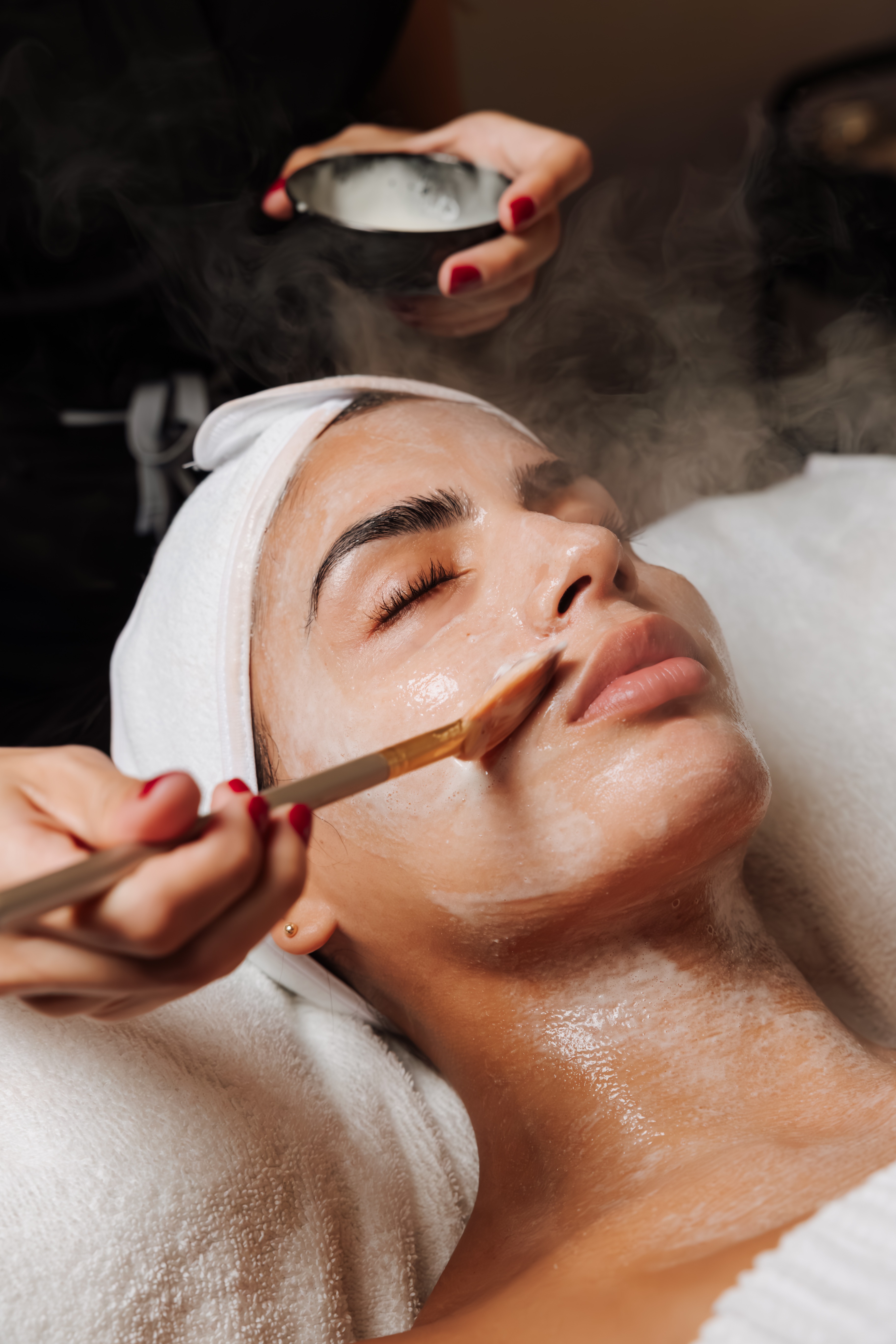 Aesthetic skincare products in a soft-focus clinical setting