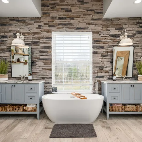 Luxurious bathroom featuring a spa-like walk-in shower, custom vanity, and elegant tile flooring.