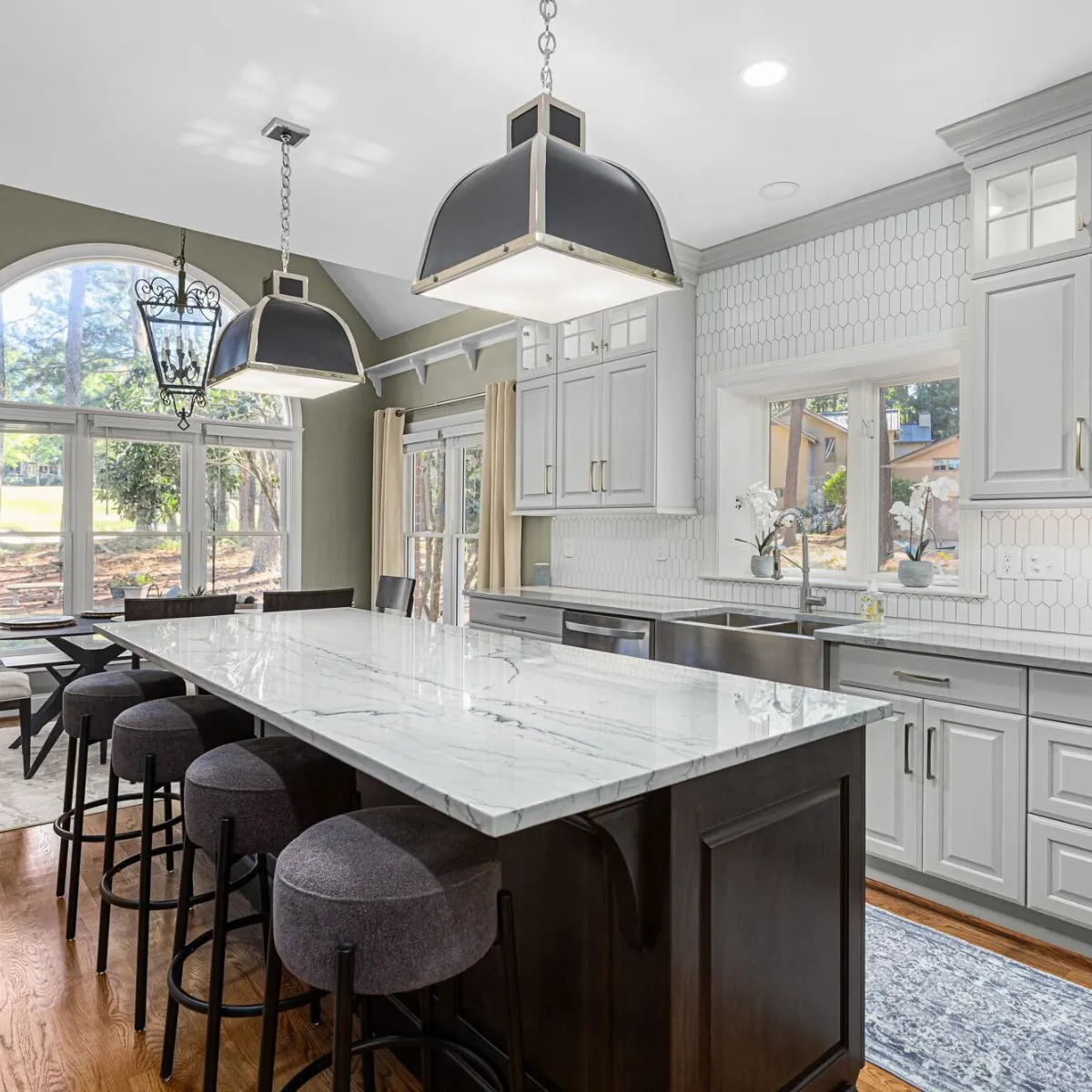 Contemporary kitchen upgrade with sleek cabinetry, stylish backsplash, and a spacious center island.
