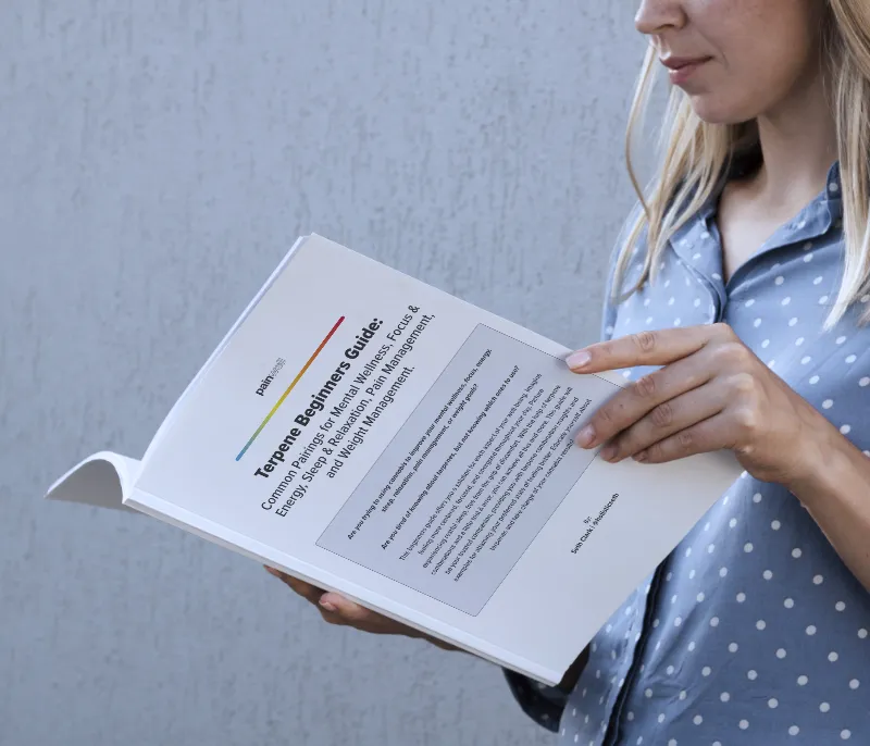 A woman reading one of Seth's terpene guides