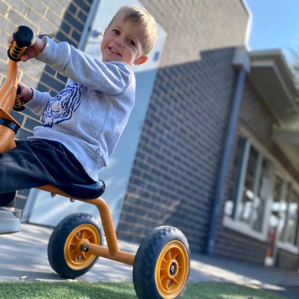 children riding a bicycle