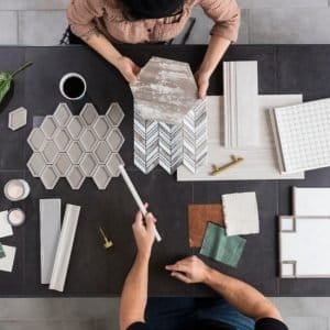 Tile design consultation with a homeowner by Grams Tile in Lunenburg, MA