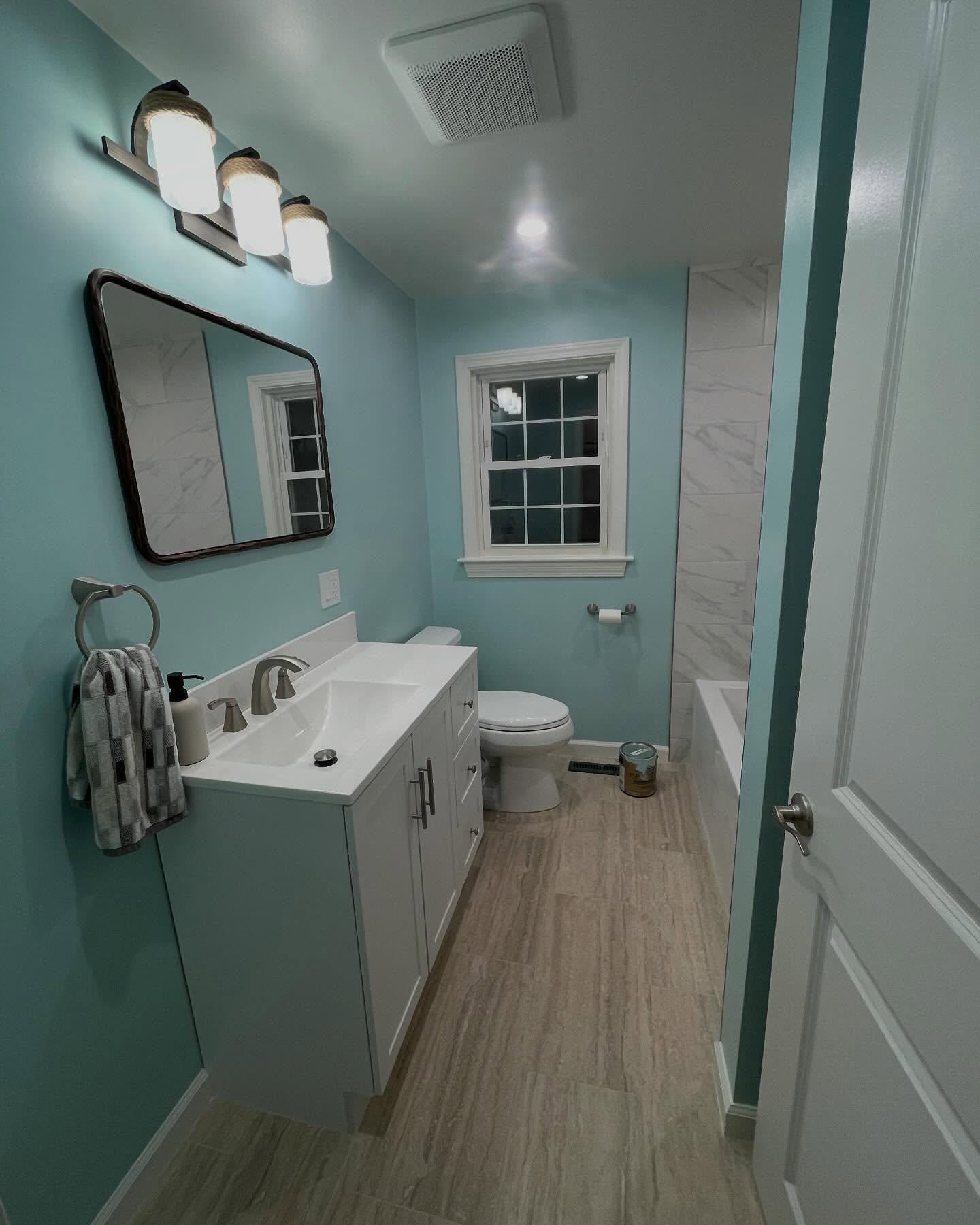 Completed bathroom remodel with custom tile work by Grams Tile in Lunenburg, MA