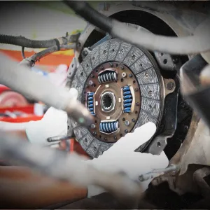 Close-up of a car clutch during repair, showcasing high-quality clutch components for seamless gear shifting.