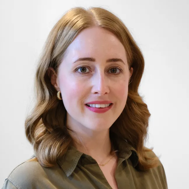 Photo of Elaine King wearing a forest-green coloured shirt, on a white background