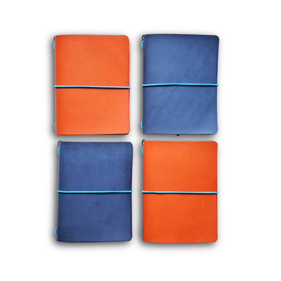Passport size travelers jounral in orange and blue leather