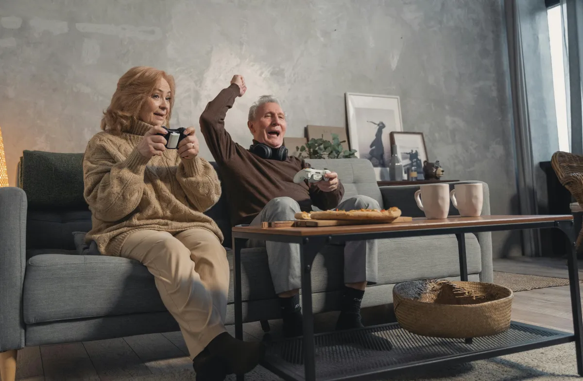 Photo by Tima Miroshnichenko: https://www.pexels.com/photo/elderly-couple-sitting-on-couch-playing-video-games-5699397/