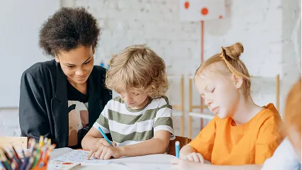 Teacher teaching two Students