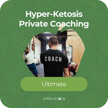 A coach in a gym setting supports clients through fitness training, representing elite private coaching in the Hyper-Ketosis program.