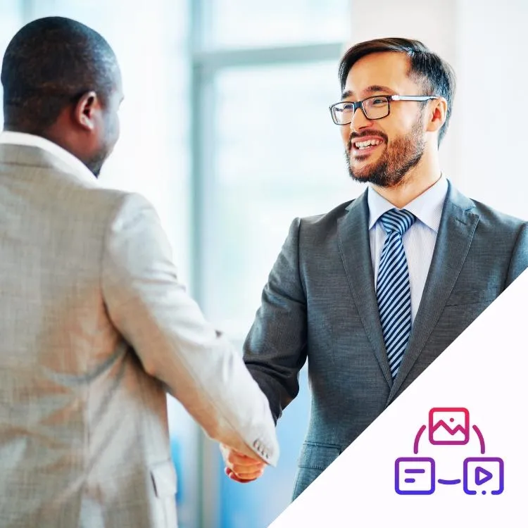 Asian business man shaking hands with a black business man in suits