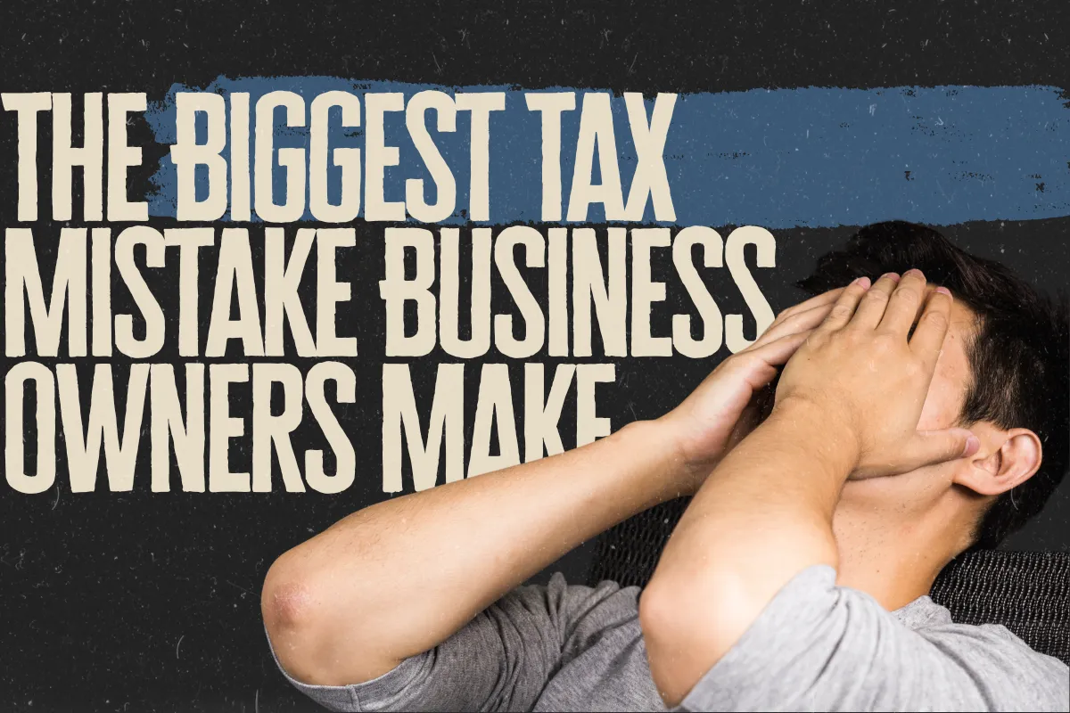 Person sitting with hands covering their face beside the headline, "The Biggest Tax Mistake Business Owners Make," on a dark textured background, illustrating the stress of poor tax planning.