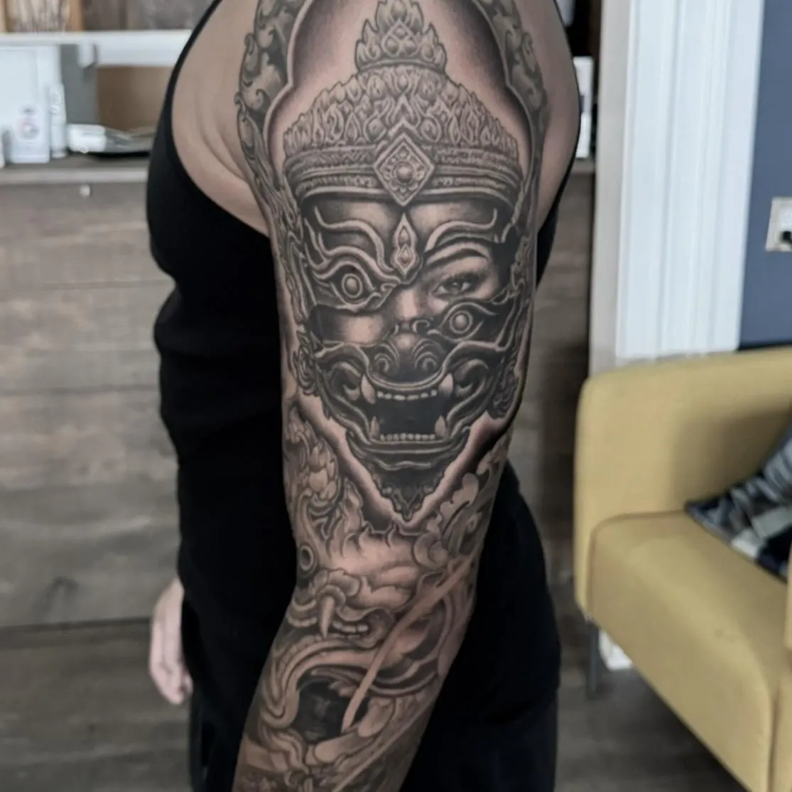 Black and grey mythological figure tattoo by Golden Koi Tattoos in Hamilton