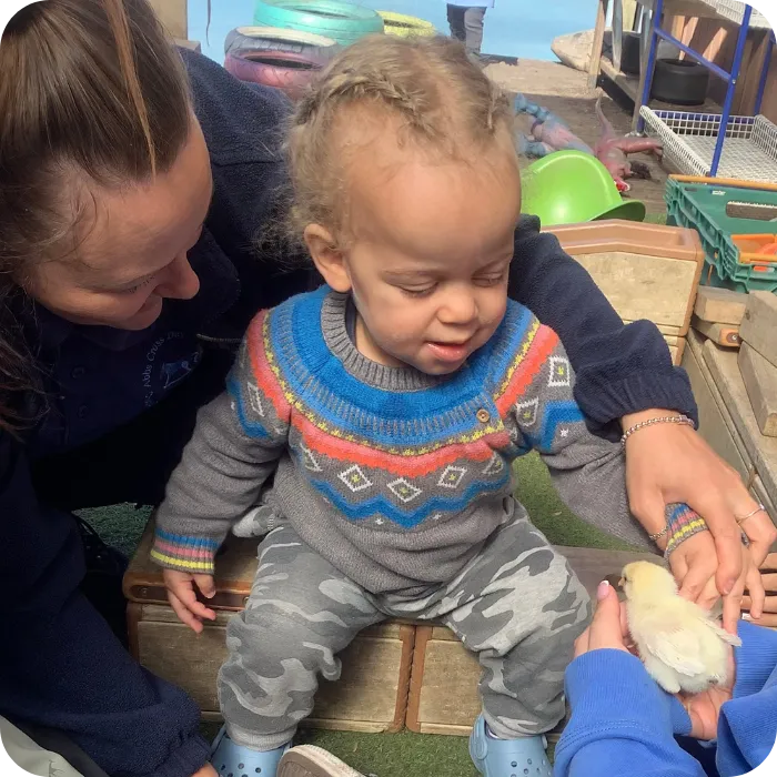child and baby playing at nursery in Hornchurch