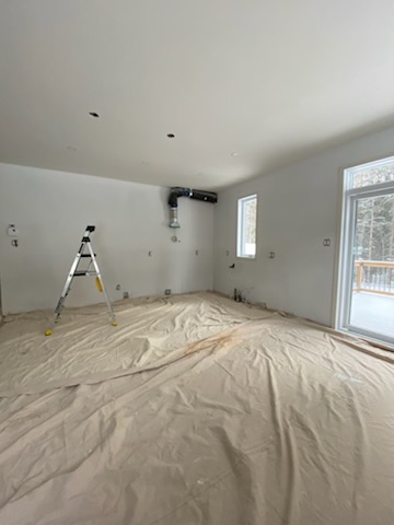 Cuisine résidentielle peinte en OC-45 Café Suisse de Benjamin Moore dans les Laurentides par Peinture Signature M