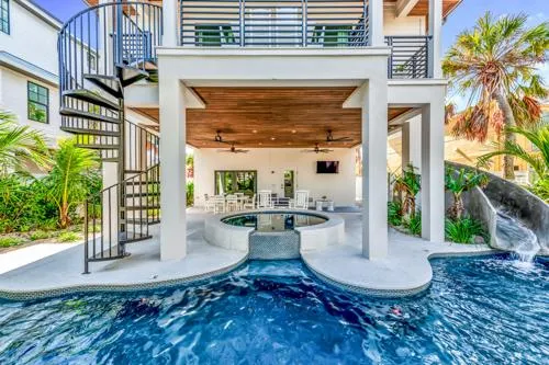 house with pool and winding stair case
