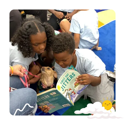 children reading book with guide dog