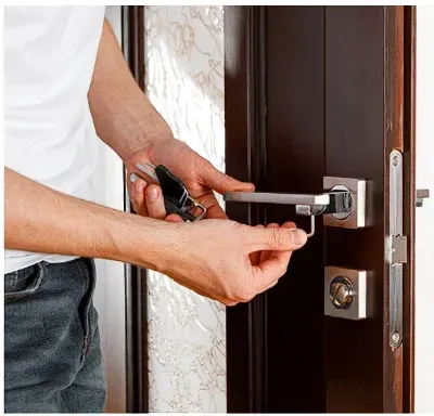 llocksmith working on door lock