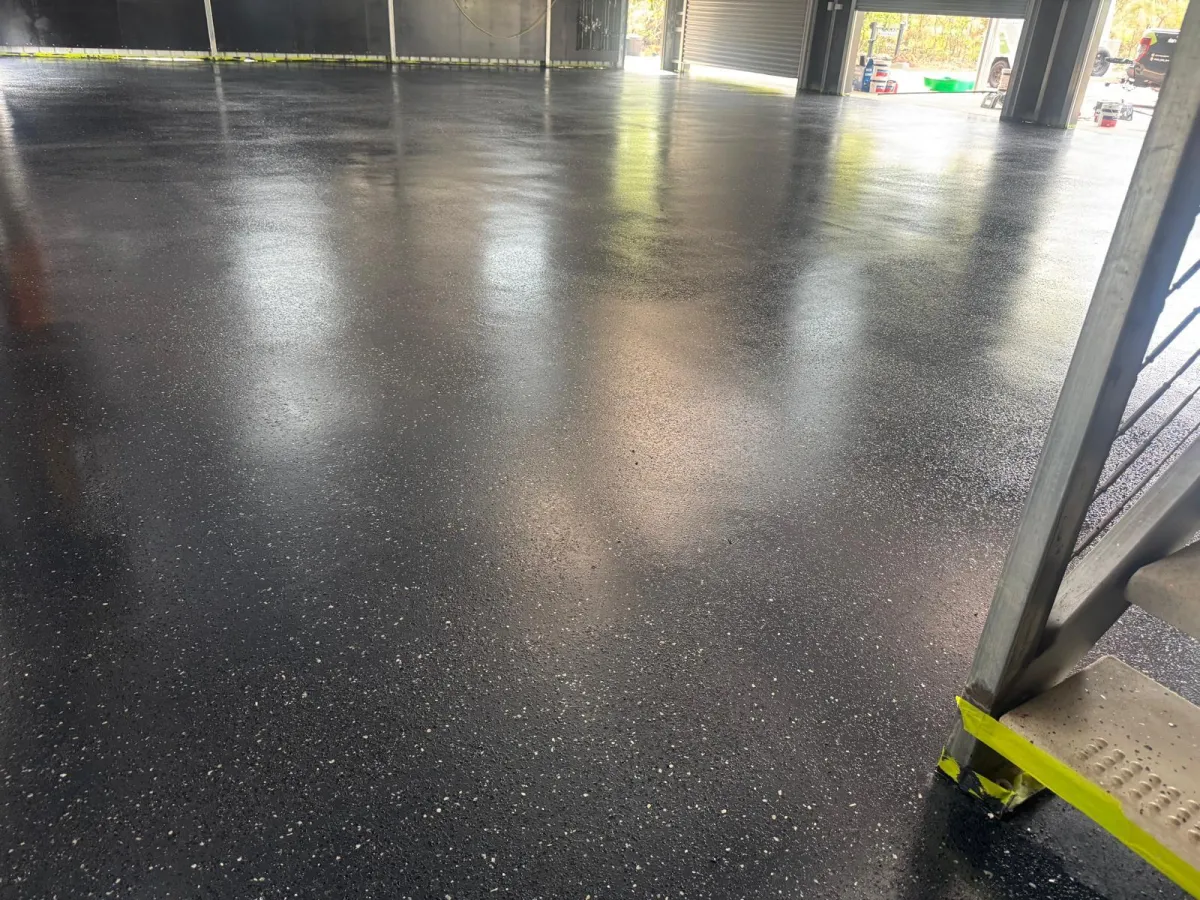 black epoxy floor with white flakes