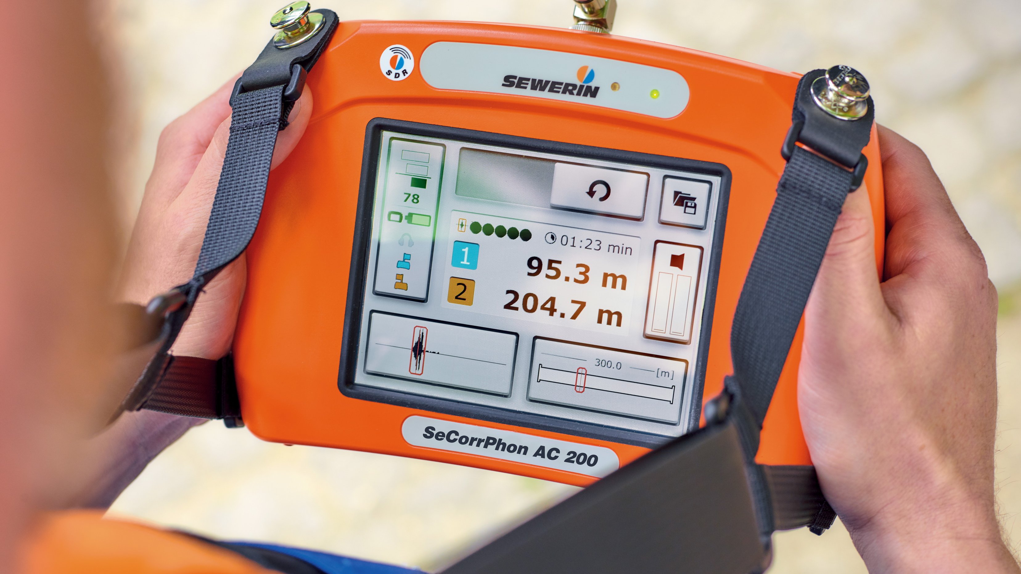 man in blue white and red plaid button up shirt wearing yellow hard hat holding black