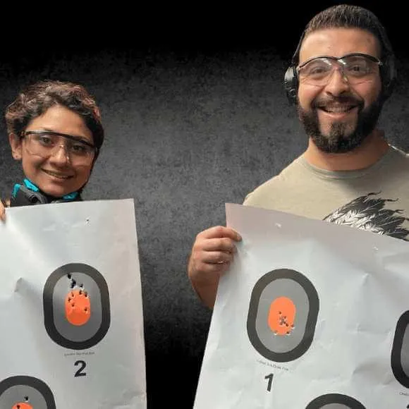Gun Range Training Class Students holding Targets
