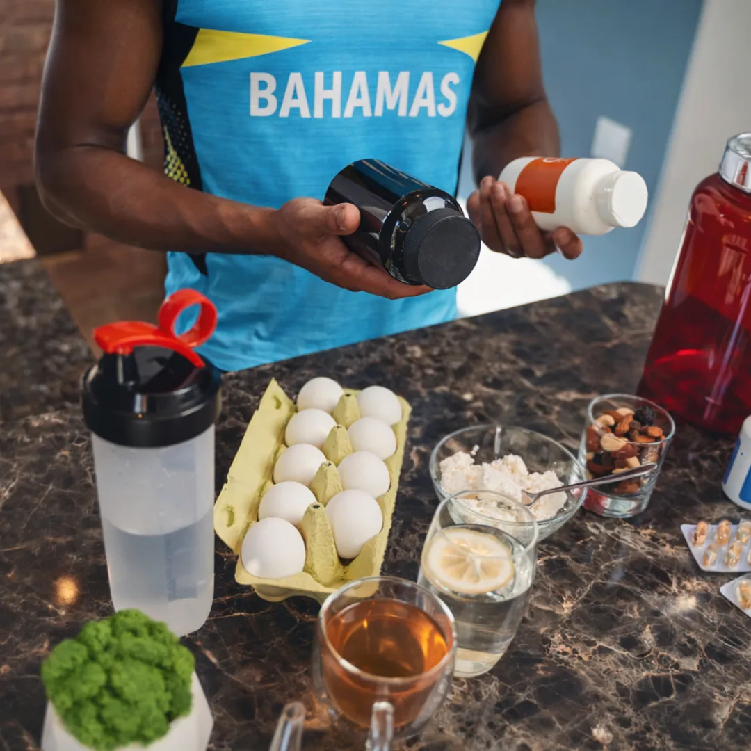 a running track with a fence in the background