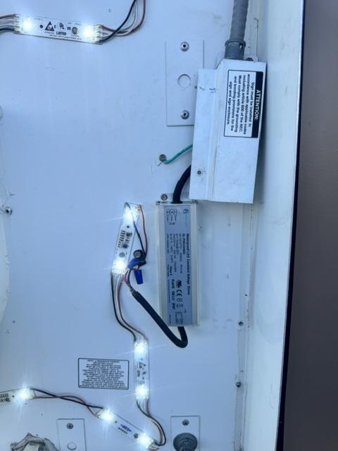 Channel letter interior during LED repair showing driver and lit modules