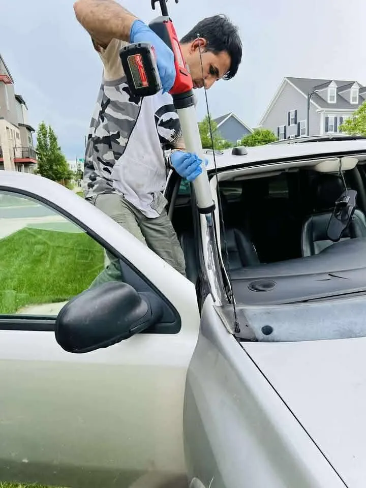 man installing windshield