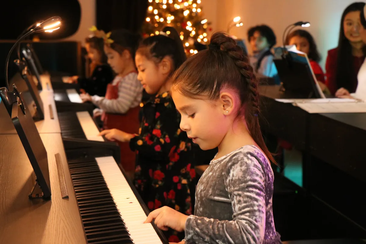 A man standing in front of a row of glass bottles