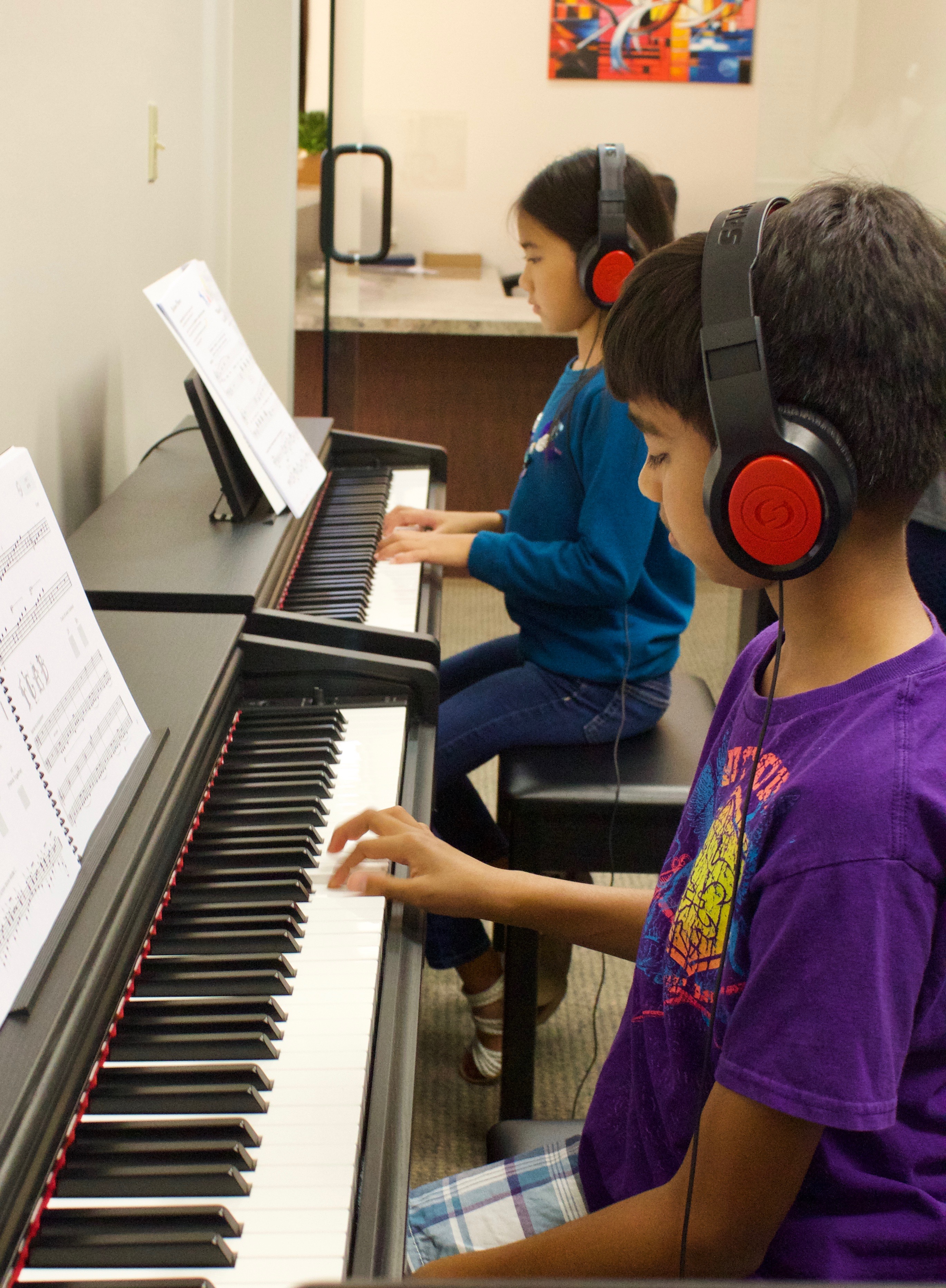 A man standing in front of a row of glass bottles