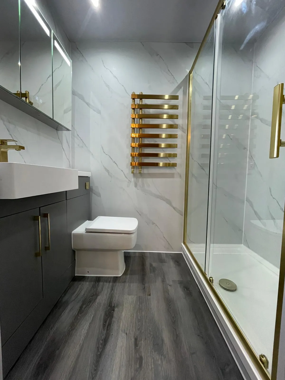 Lamps and artwork decorate a dimly lit room.