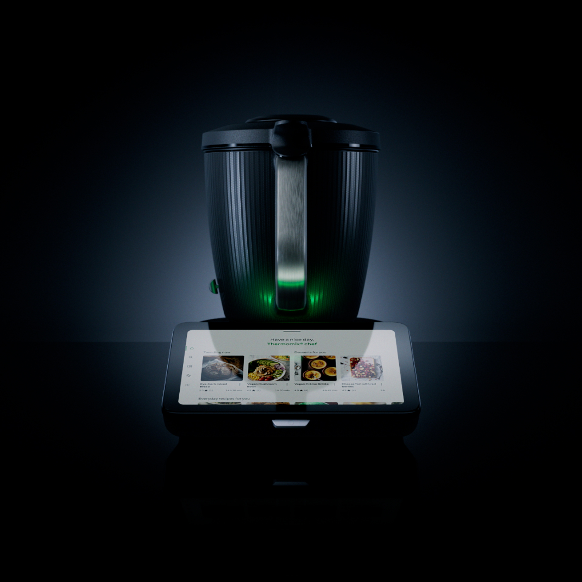 A warm, premium lifestyle shot of a Thermomix® in a clean kitchen setting