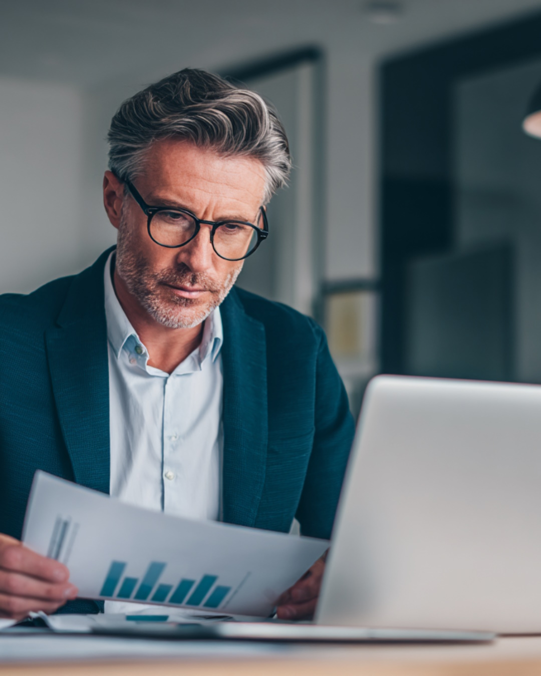 Massachusetts real estate investor reviewing rental income reports and financial projections for a DSCR investment property deal