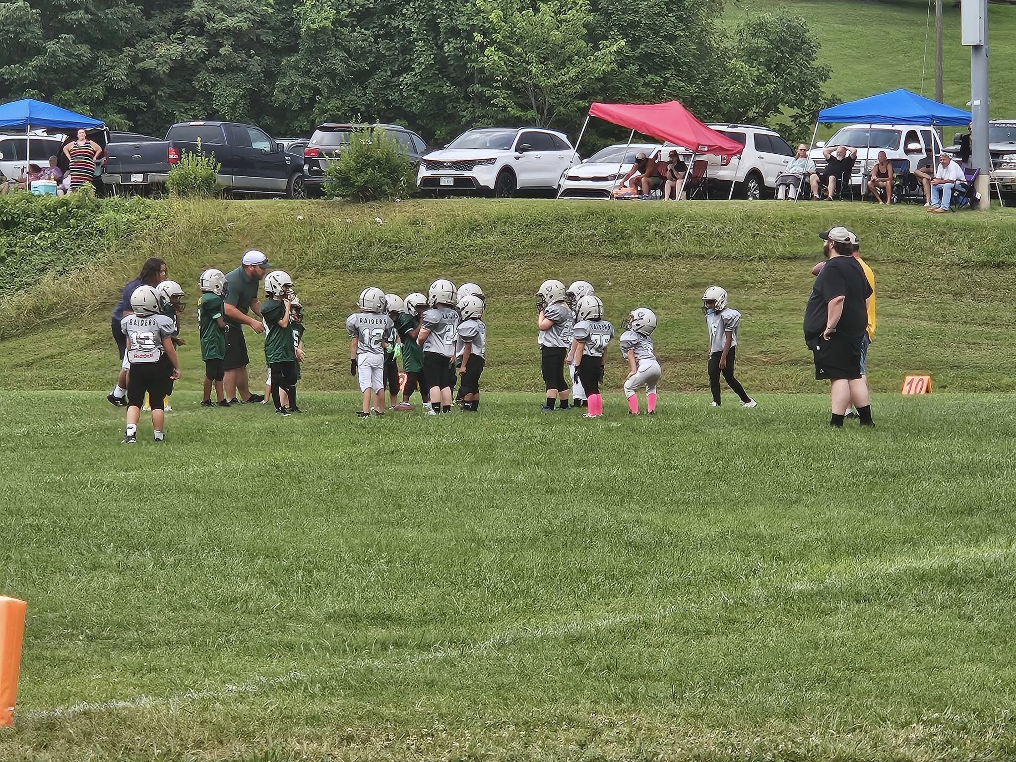 White-and-green youth football helmet in Lynn Garden colors on a clean background.