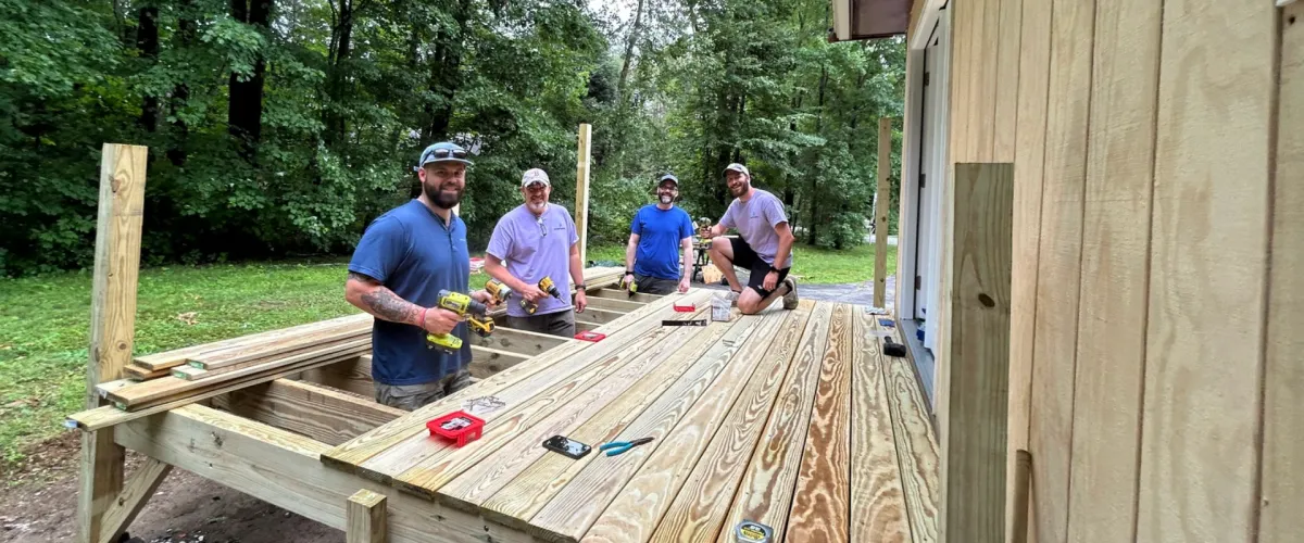 Group of volunteers repairing a home during a Fuller Center project in Delaware.