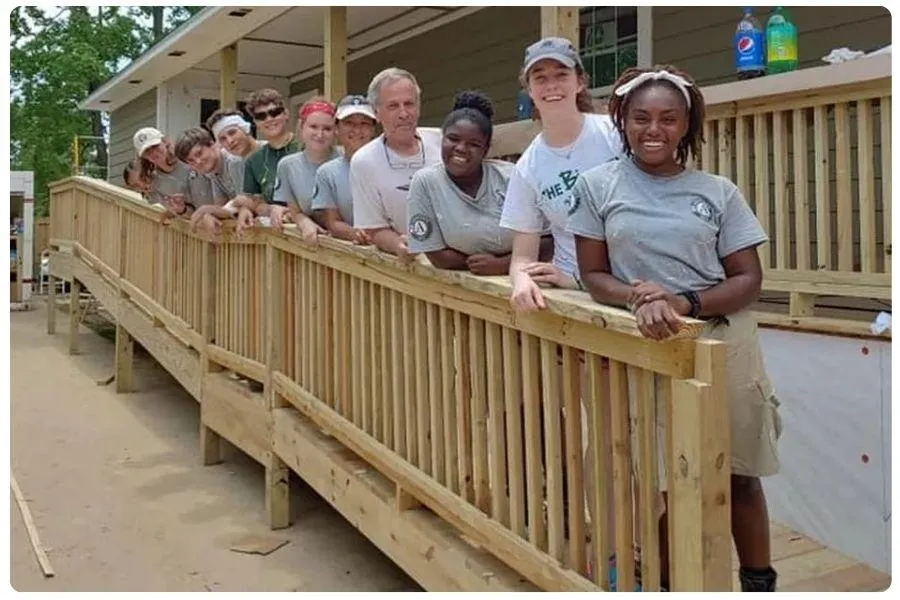 Construction crew building a wooden ramp for accessibility