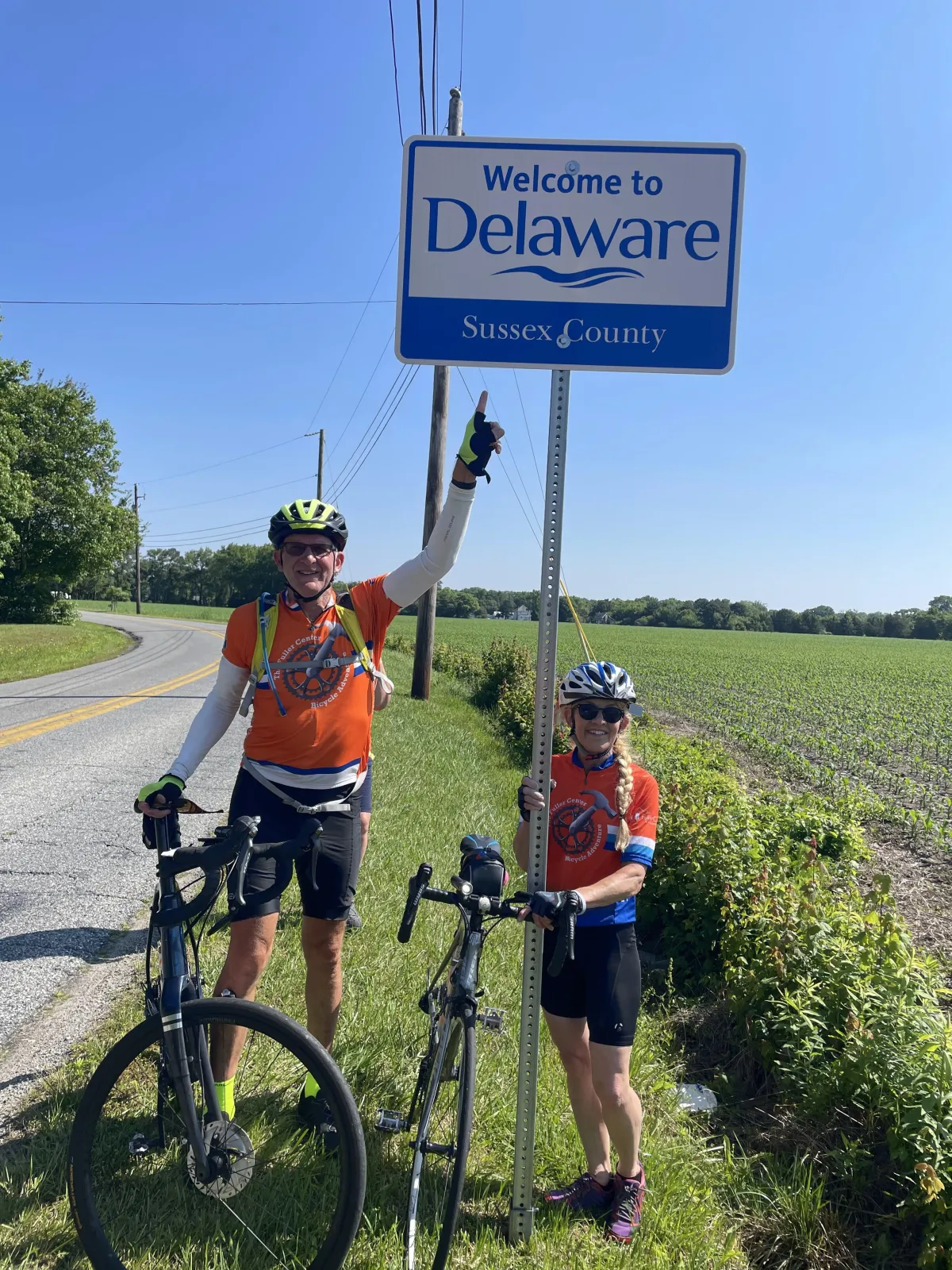 The first two cyclists arrive at the Delaware state line.