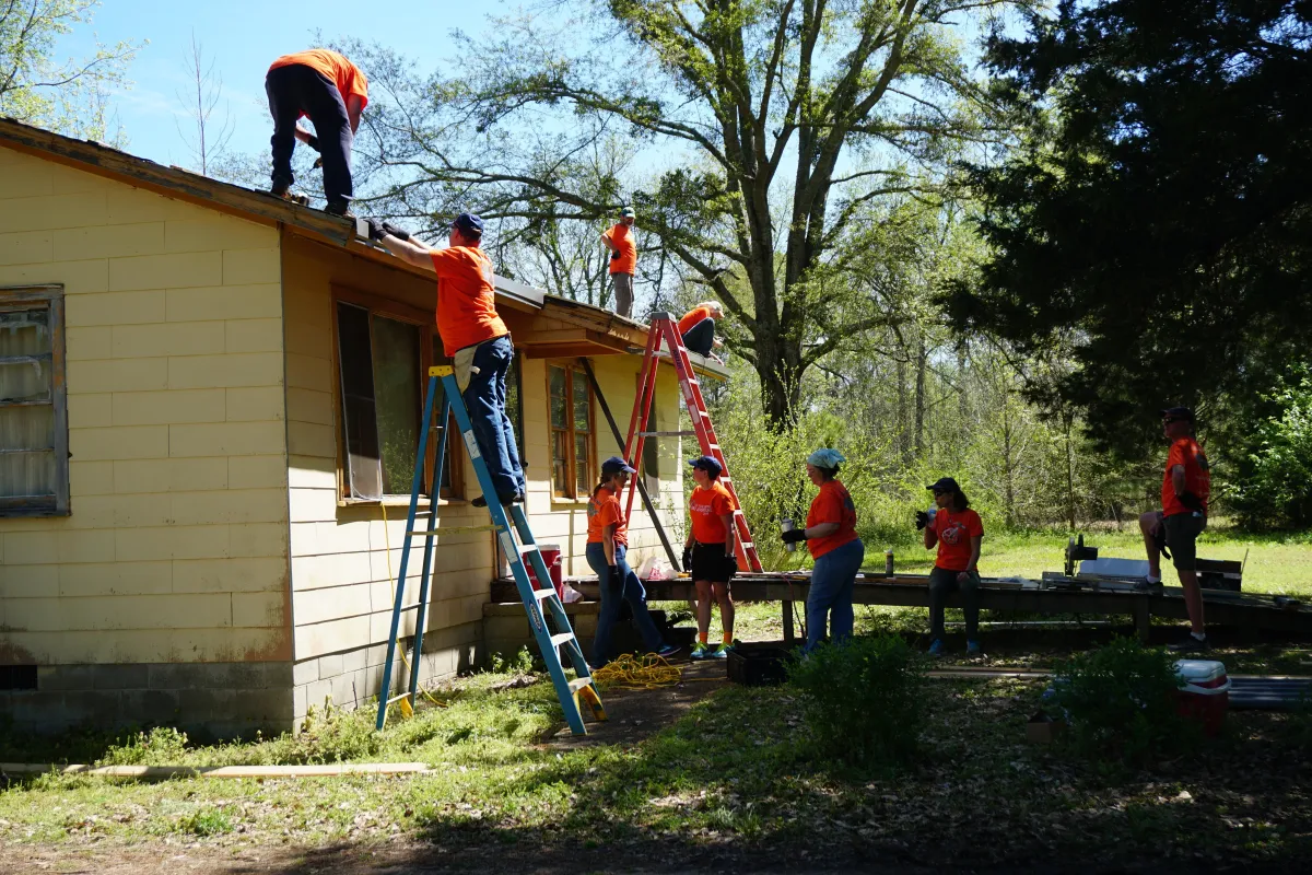 Community members gathered for Fuller Center housing project