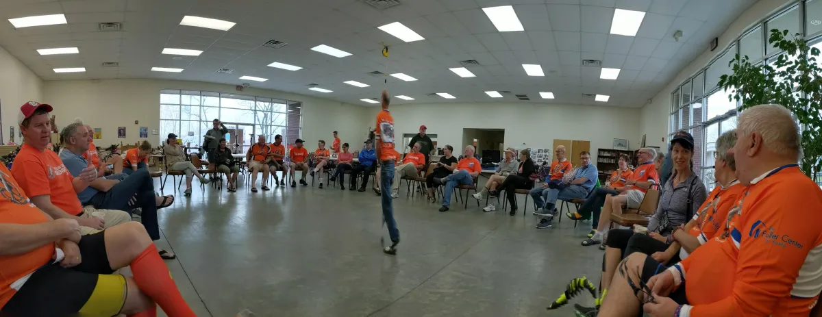Volunteers gathered in a circle for a moment of prayer before a home repair project.